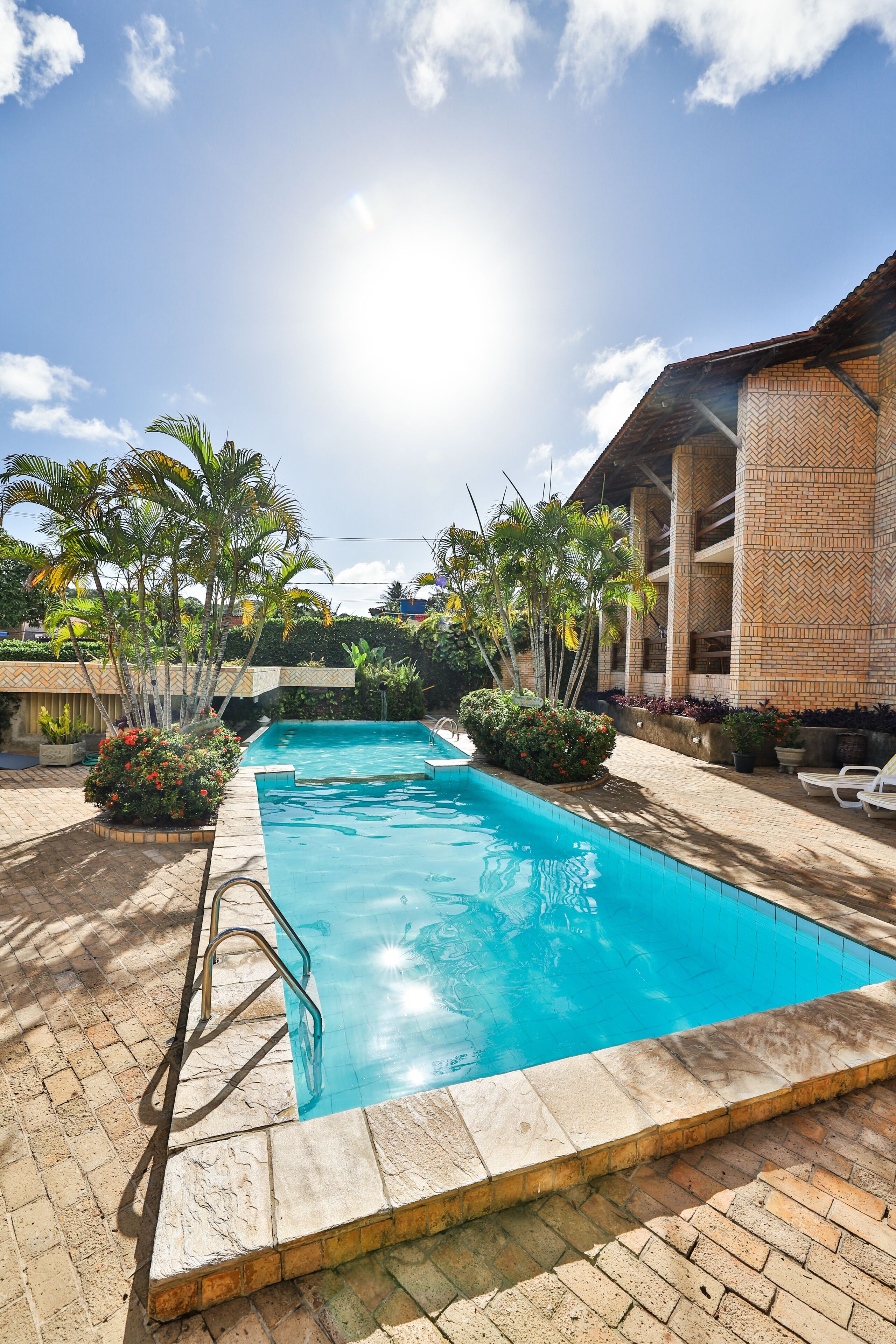 outdoor pool, open 8:00 am to 10:00 pm, pool umbrellas, pool loungers