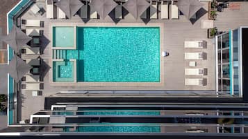 Seasonal outdoor pool, pool umbrellas, pool loungers