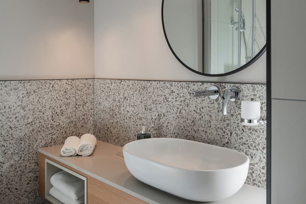 hair dryer, slippers, bidet, towels