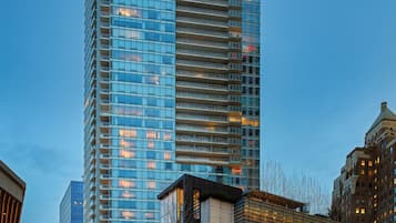 A high-rise hotel with multiple floors, large windows, and a modern architectural design.