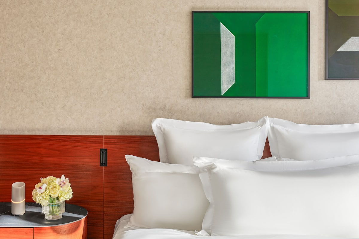 Premium bedding, down comforters, pillowtop beds, minibar