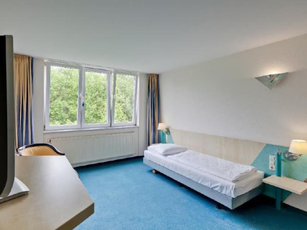 Hypo-allergenic bedding, desk, blackout drapes, iron/ironing board