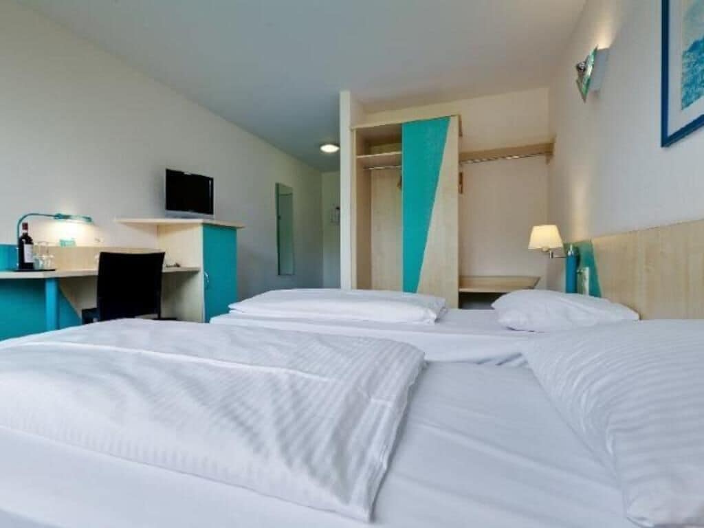 Hypo-allergenic bedding, desk, blackout drapes, iron/ironing board