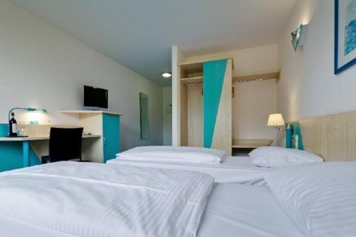 Hypo-allergenic bedding, desk, blackout drapes, iron/ironing board