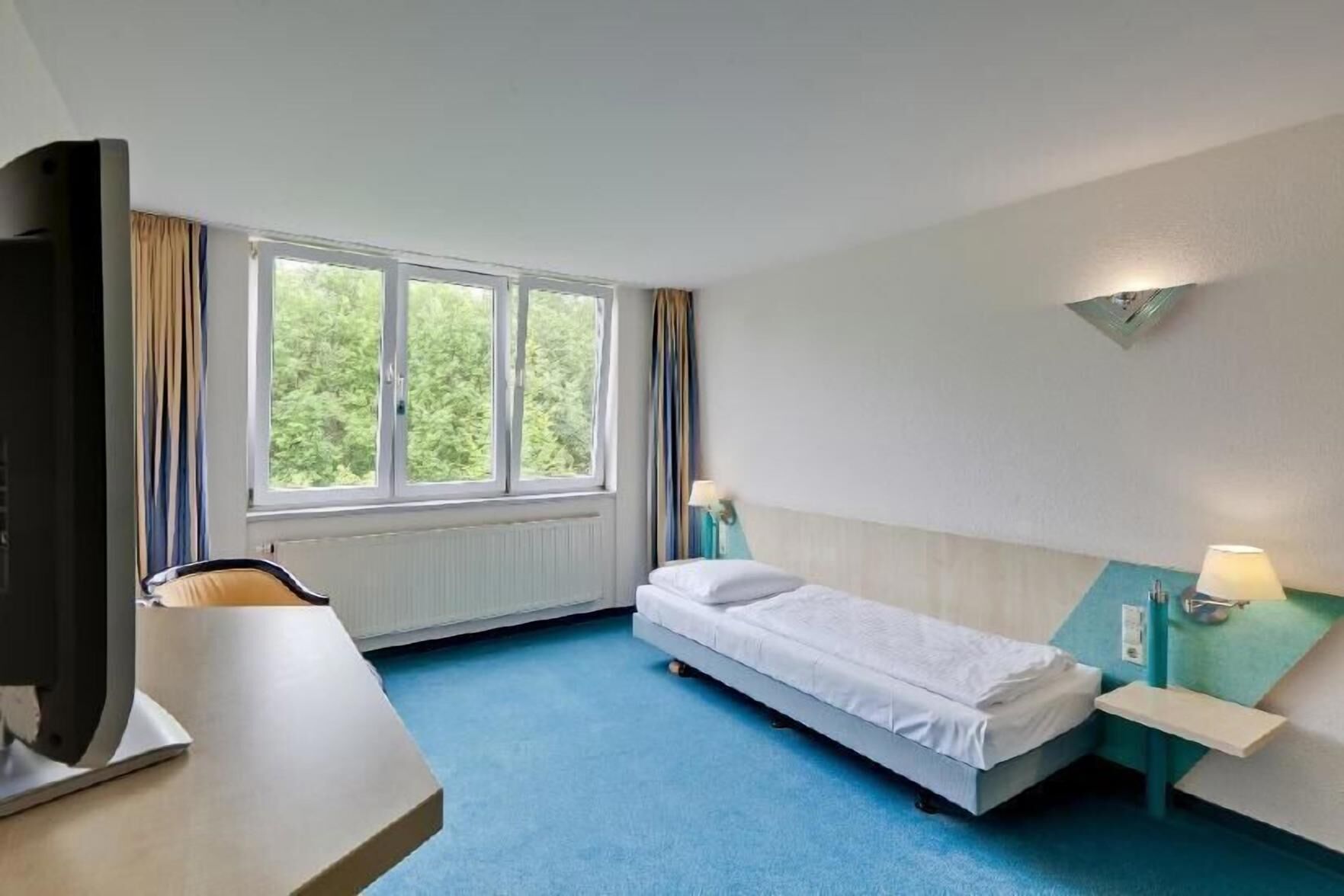 Hypo-allergenic bedding, desk, blackout drapes, iron/ironing board