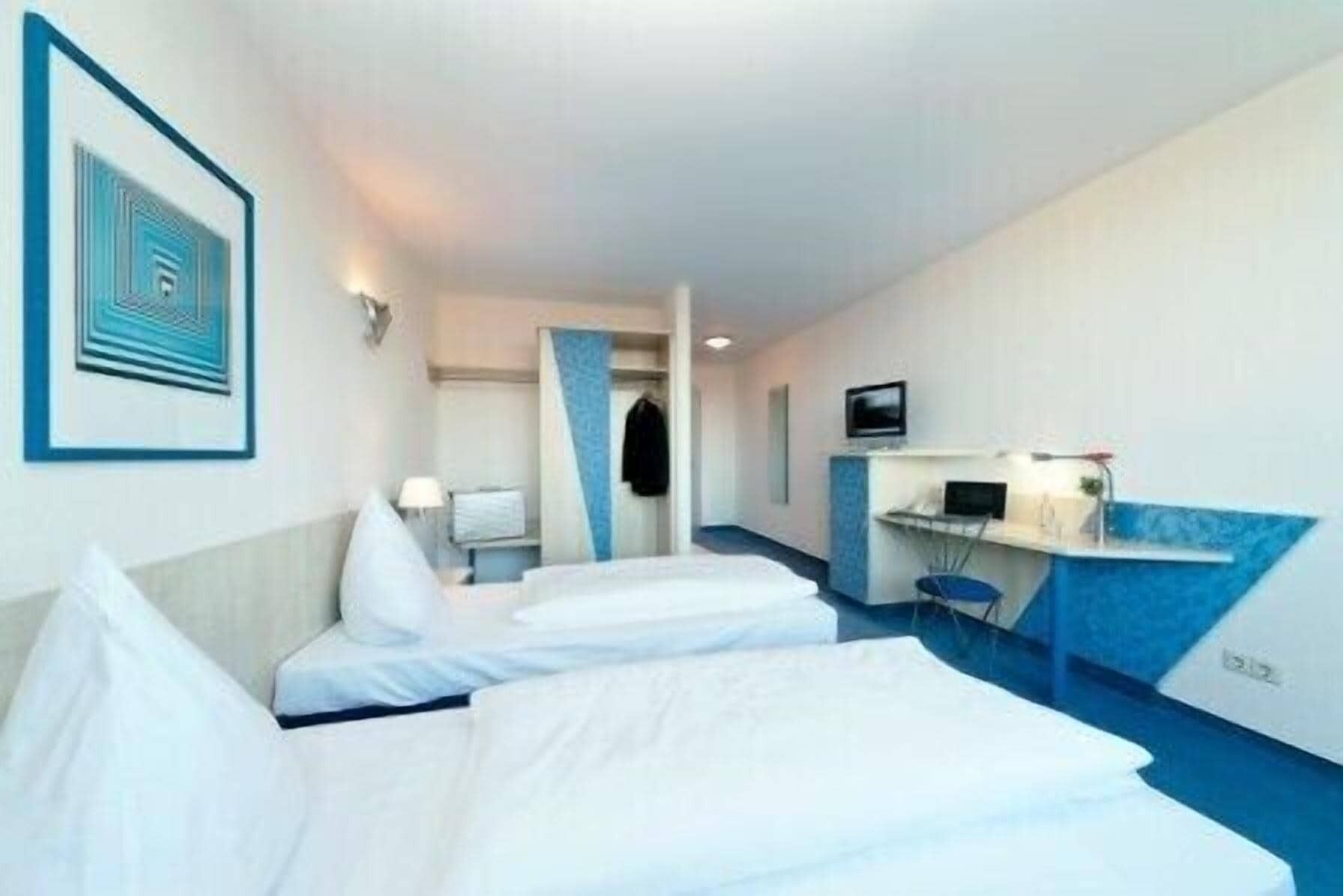 Hypo-allergenic bedding, desk, blackout drapes, iron/ironing board