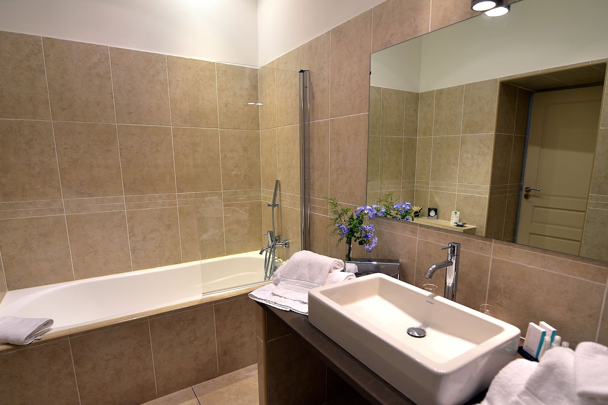 superior junior | bathroom | designer toiletries, hair dryer, bathrobes, slippers