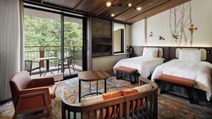 A hotel room with two beds, a balcony, a dining area, and a TV. - Karuizawa Prince Hotel West (Karuizawa)