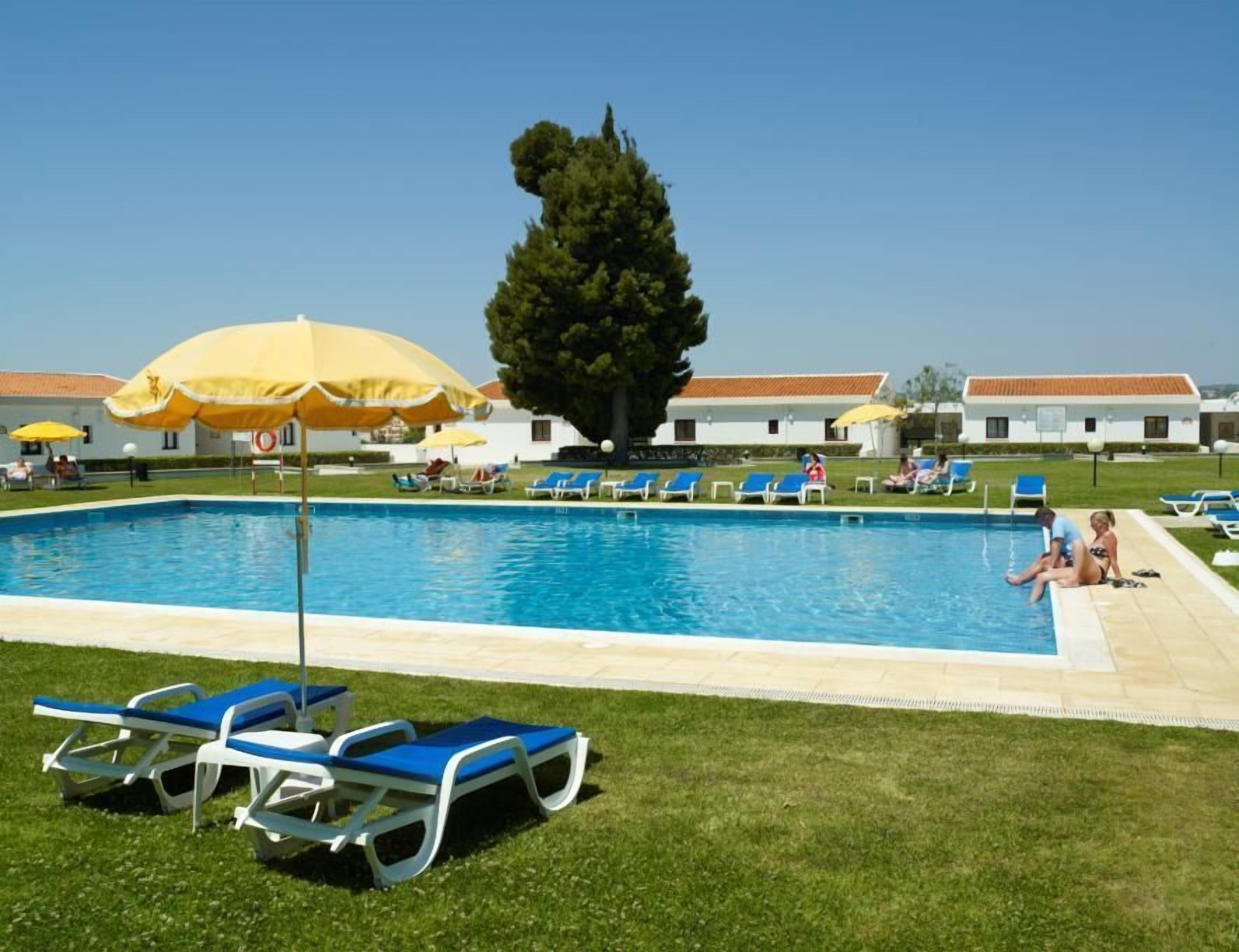 outdoor pool, open 10 am to 9:30 pm, pool loungers