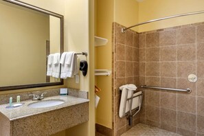 Combined shower/tub, free toiletries, hair dryer, slippers