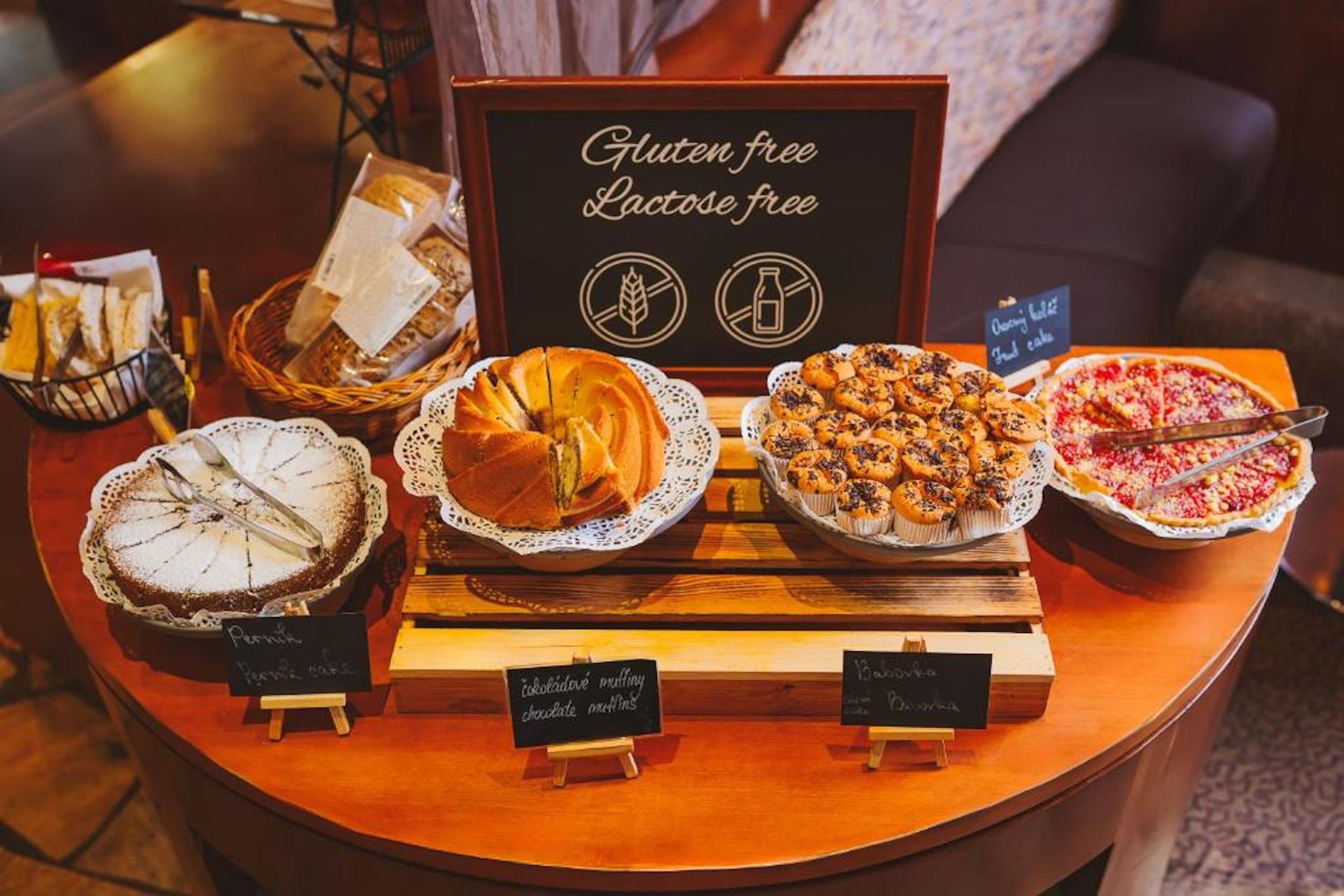 A gluten and lactose-free dessert display with various baked goods.