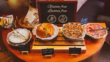 A gluten and lactose-free dessert display with various baked goods.