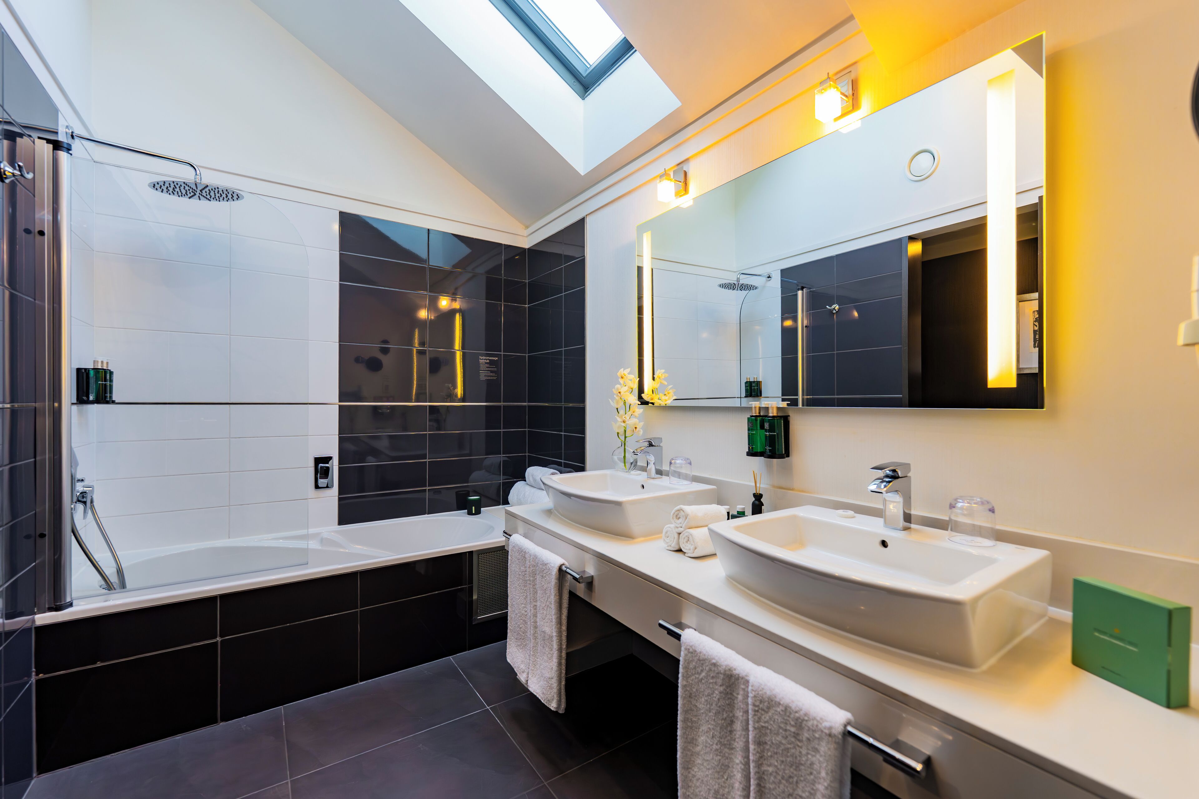 junior suite | bathroom | designer toiletries, hair dryer, bathrobes, slippers