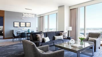 Luxury Suite, 1 King Bed, Non Smoking | Living area | 42-inch plasma TV with cable channels, TV, DVD player