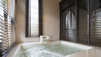 Separate tub and shower, jetted tub, rainfall showerhead