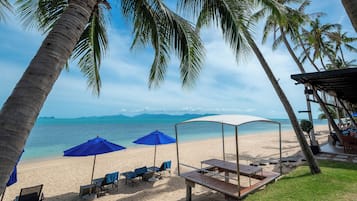 On the beach, sun loungers, beach umbrellas, beach towels