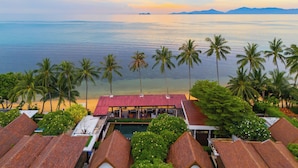 A resort with a pool, beach, and palm trees. - The Sea Koh Samui Resort & Residences by Tolani (Koh Samui)