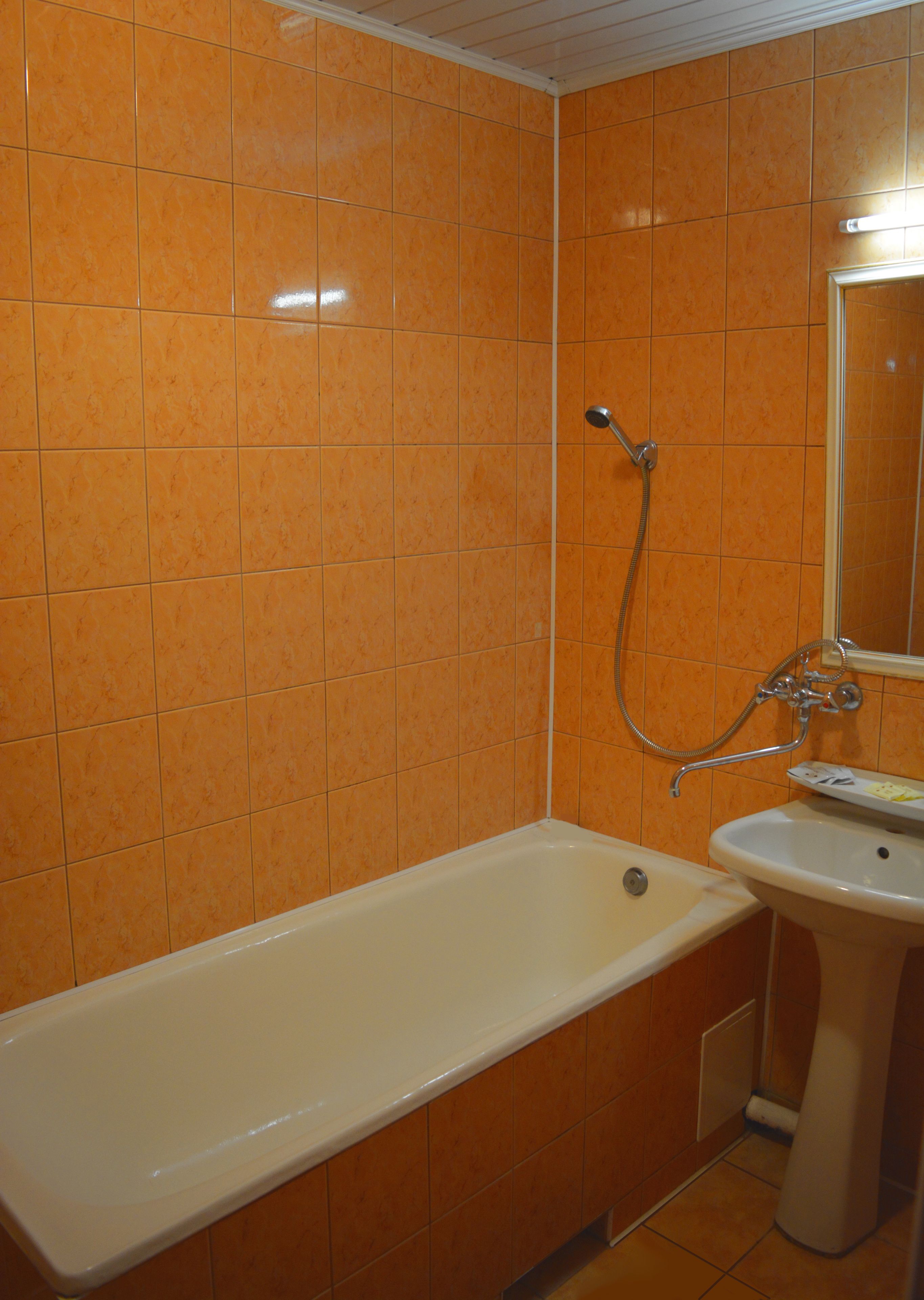 A bathroom with a bathtub, a sink, and a shower.