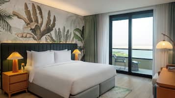 Deluxe Room, 1 King Bed, Balcony, Sea View | Premium bedding, minibar, in-room safe, individually decorated