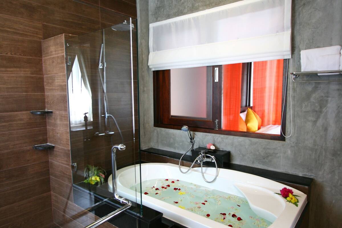 gloriyo hillside villas. | bathroom | separate bathtub and shower, rainfall showerhead, free toiletries