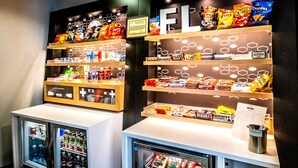 A snack display with various chips and mints. - Hampton Inn & Suites Sarasota/Bradenton-Airport, FL (Sarasota)