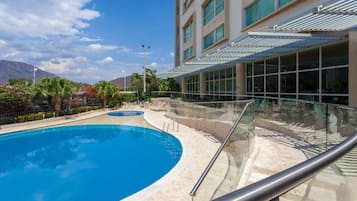 Outdoor pool, pool umbrellas, sun loungers