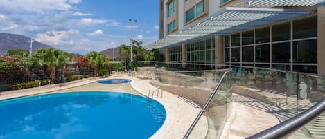 Outdoor pool, pool umbrellas, sun loungers