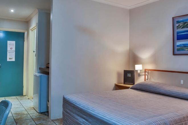 Desk, iron/ironing board, bed sheets, alarm clocks