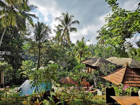 4 outdoor pools, sun loungers. Puri Saron Hotel Madangan