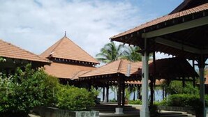 A traditional building with a tiled roof and a covered walkway.