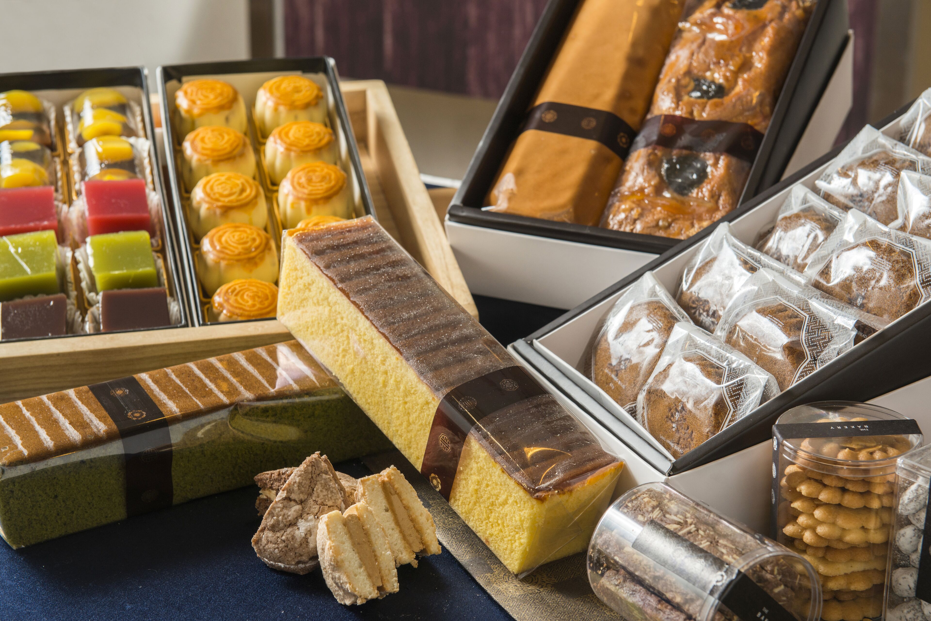 A variety of pastries and desserts displayed in trays.