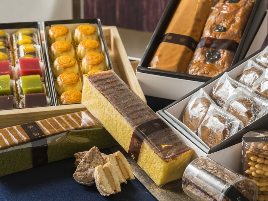 A variety of pastries and desserts displayed in trays.