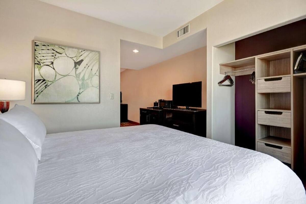 Premium bedding, desk, blackout drapes, iron/ironing board