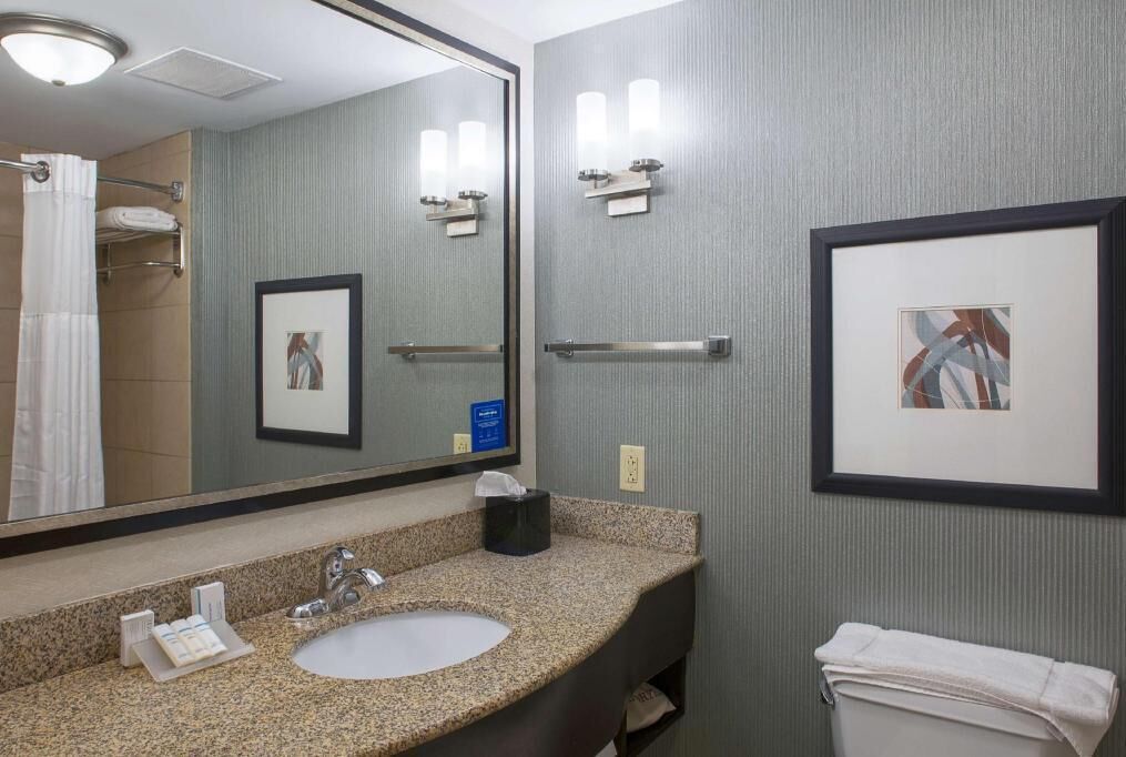 Bathroom | Shower, designer toiletries, hair dryer, towels