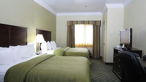 A hotel room with two beds, a desk with a computer, a TV, and a window with curtains. - Best Western Cresson Inn (Cresson)