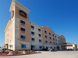 A Best Western hotel with a stone facade, multiple windows, and a parking lot.