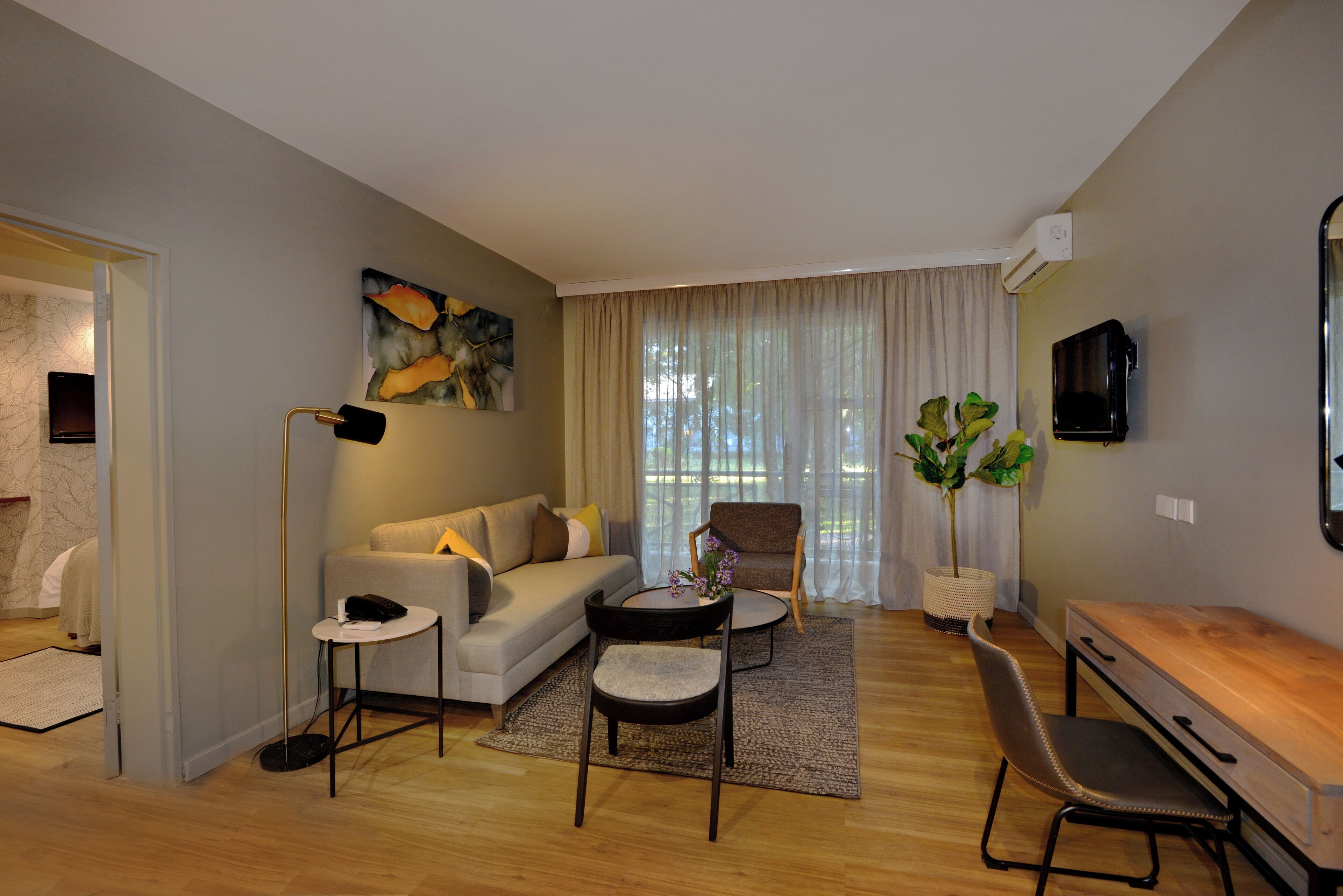 superior suite, 1 double bed, ensuite, garden view | living area | flat-screen tv