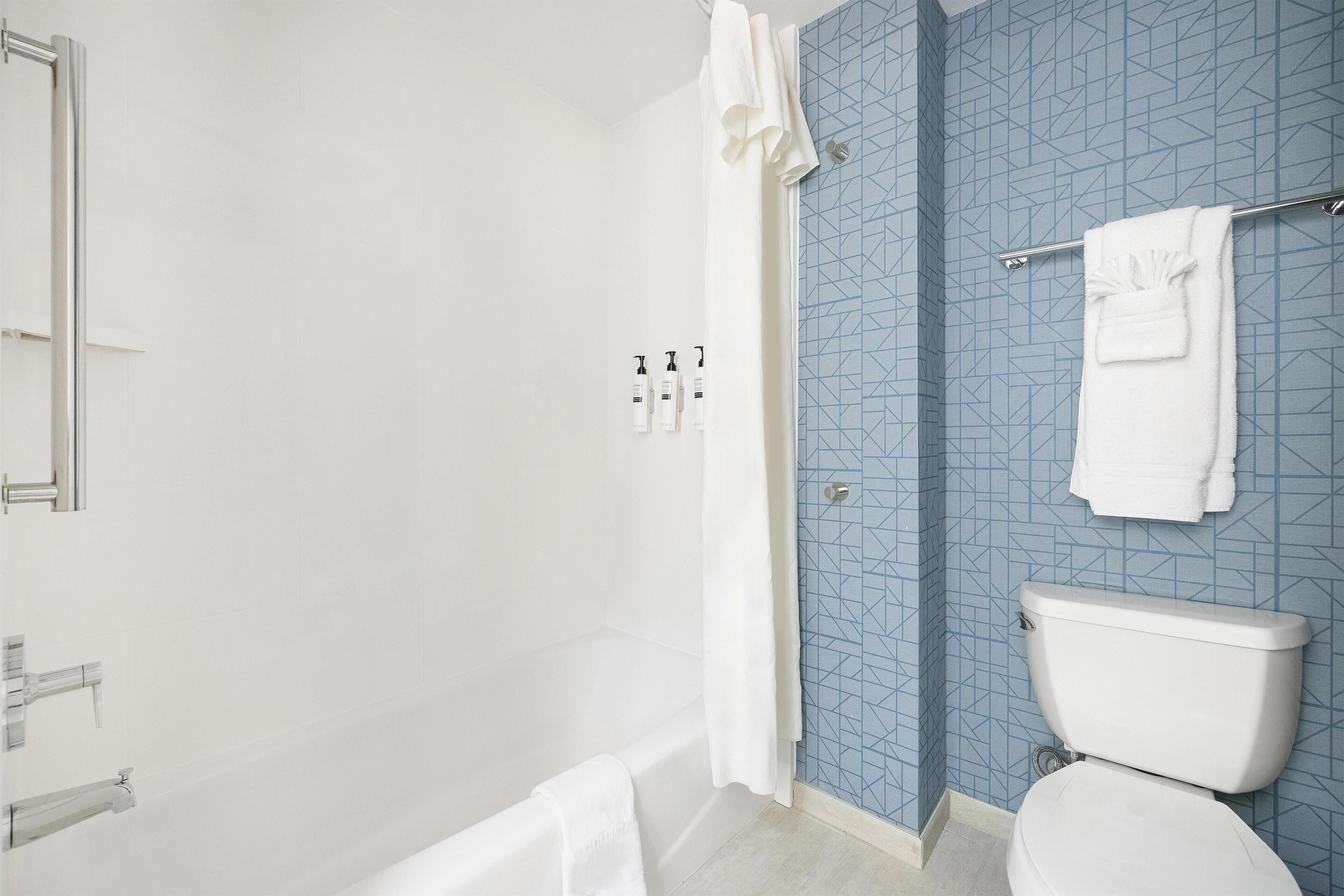 Bathtub, free toiletries, hair dryer, towels