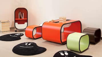 Children can play and learn on the modular play structure and play mats in this vibrant play area.