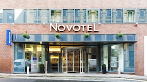 A brick building with a glass entrance and the Novotel logo. - Novotel Liverpool Centre (Liverpool)