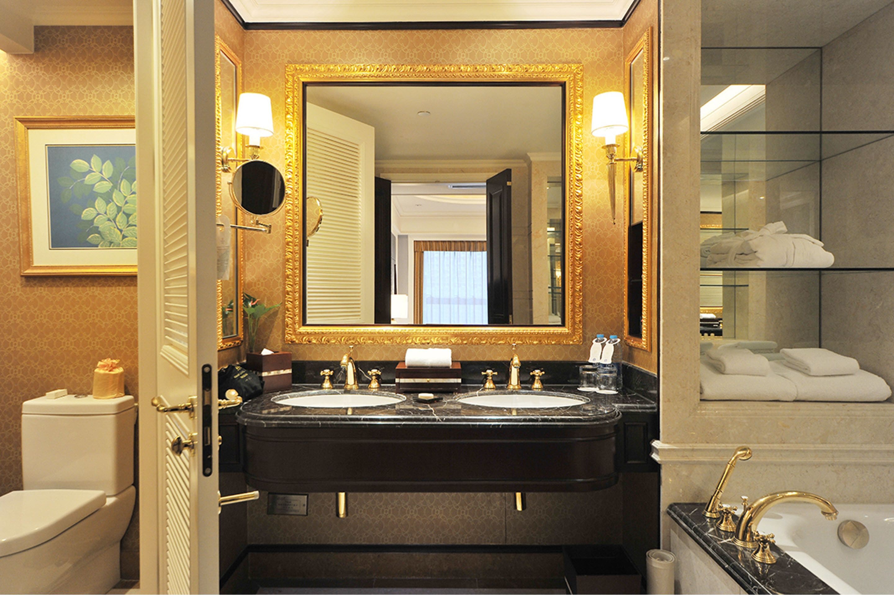 executive suite | bathroom | separate bathtub and shower, rainfall showerhead, designer toiletries