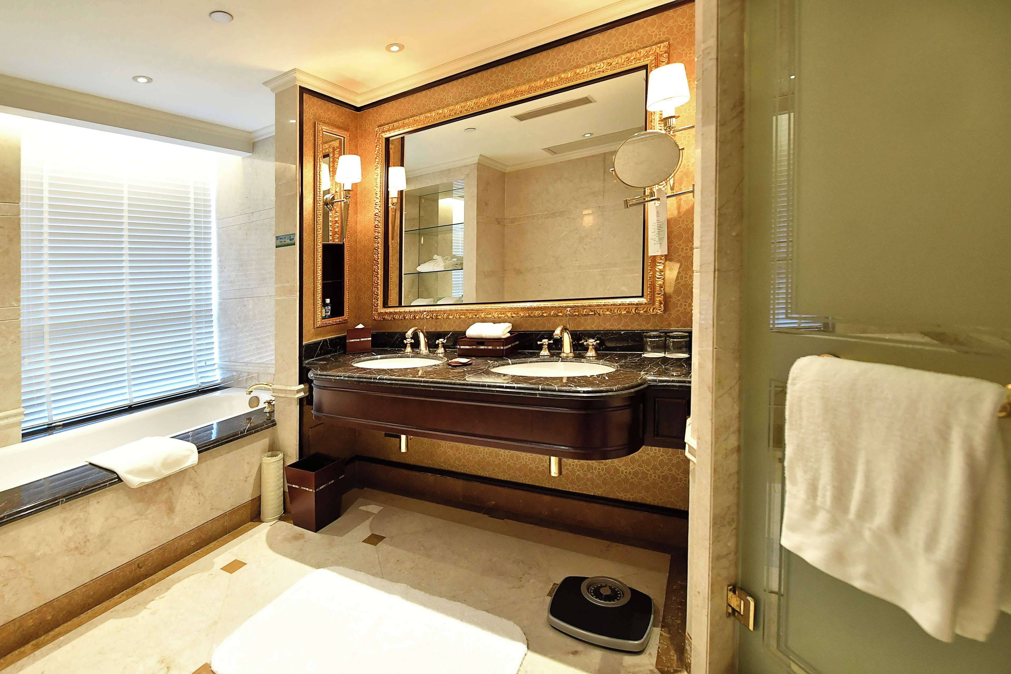 business suite | bathroom | separate bathtub and shower, rainfall showerhead, designer toiletries