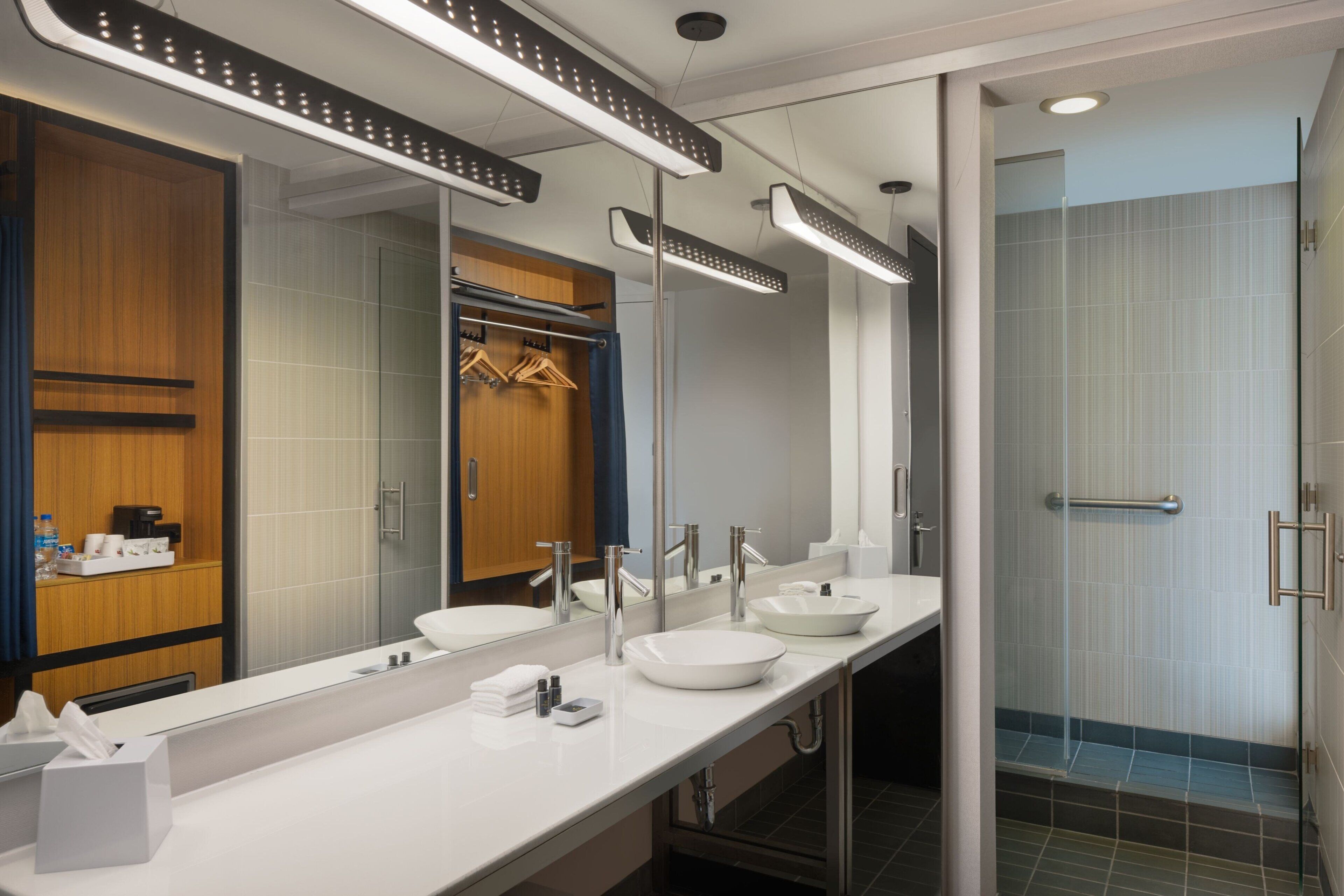 shower, designer toiletries, hair dryer, towels