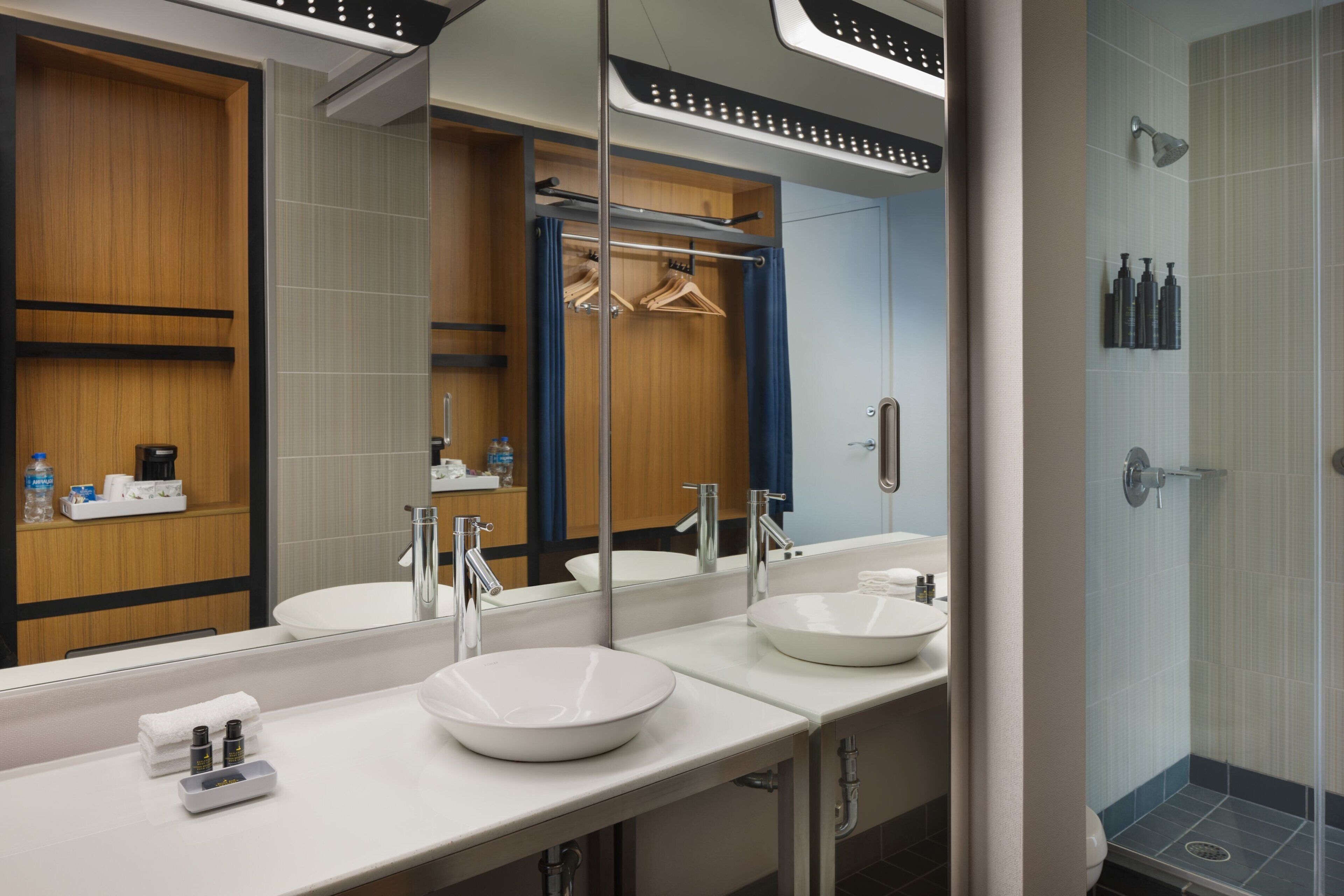 shower, designer toiletries, hair dryer, towels