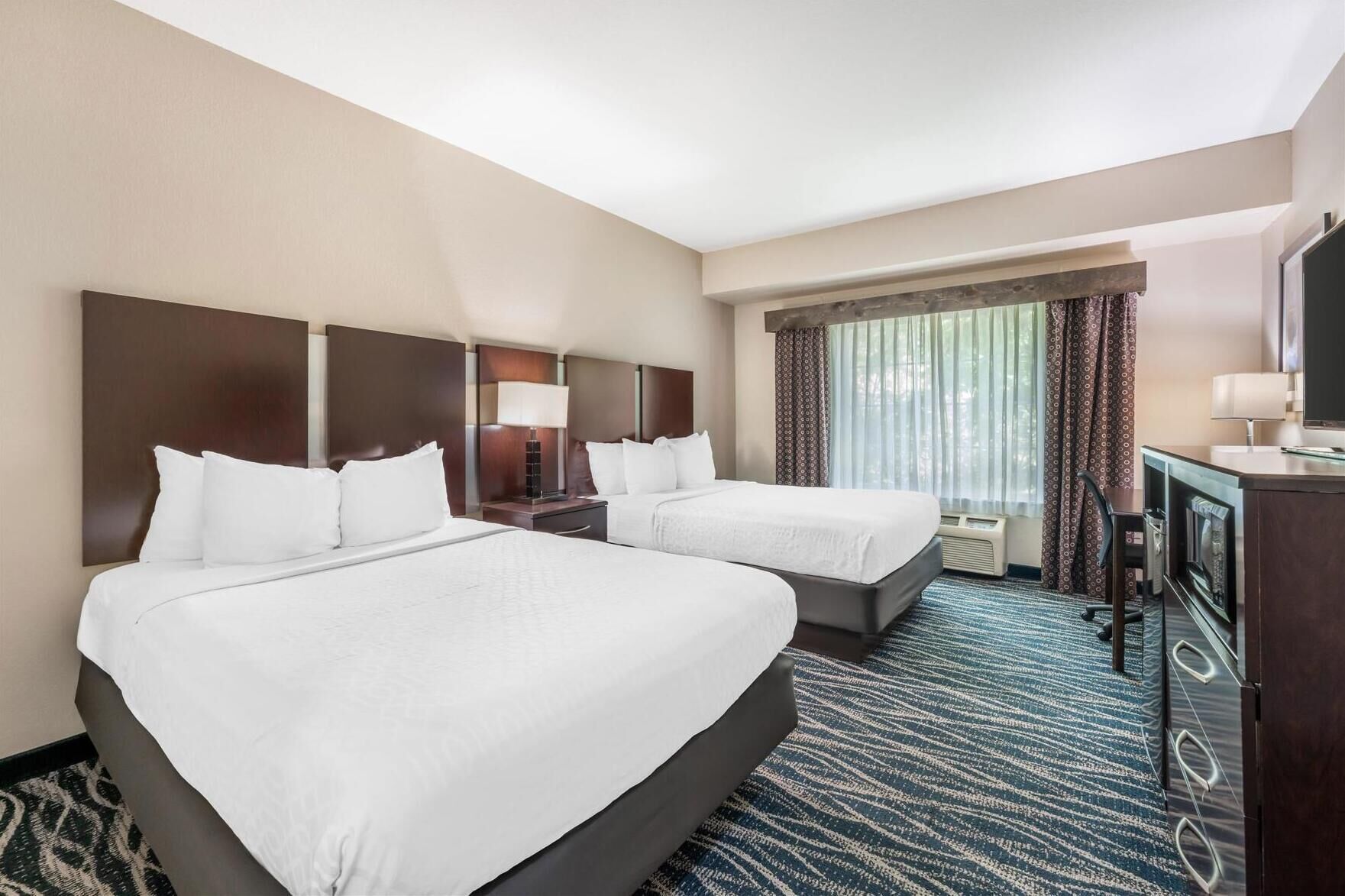 Premium bedding, pillowtop beds, desk, blackout drapes