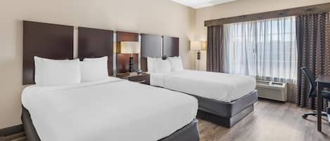 Premium bedding, pillow-top beds, desk, blackout curtains