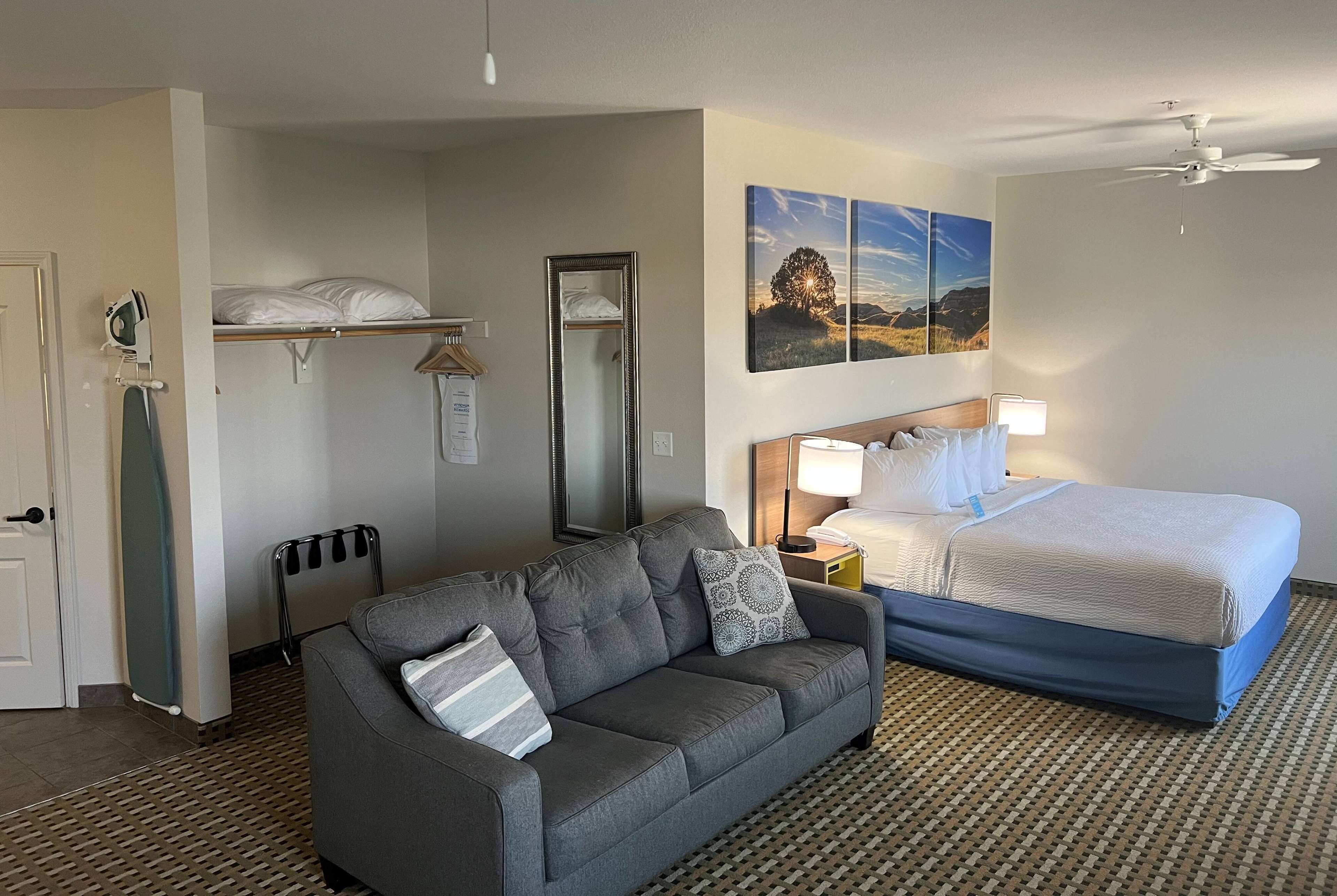 suite, 1 king bed with sofa bed, non smoking | in-room safe, desk, iron/ironing board, free cots/infant beds