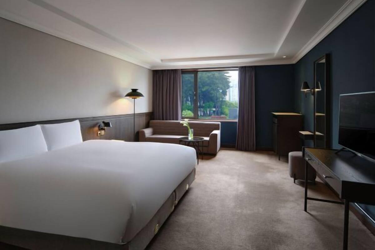 Luxe beddengoed, een minibar, een kluis op de kamer, een bureau