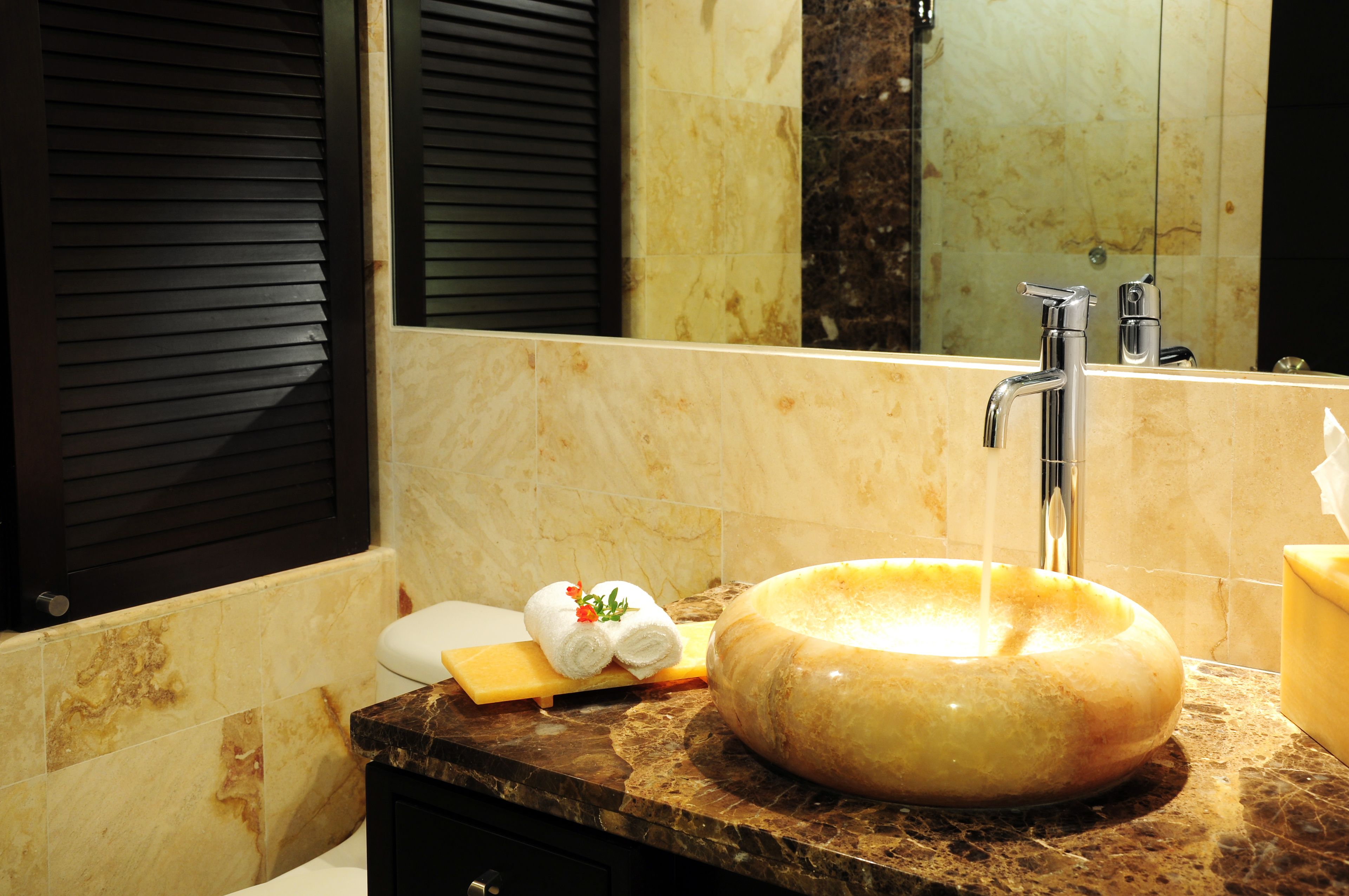 deluxe condo, 1 king bed, private bathroom | bathroom | shower, eco-friendly toiletries, hair dryer, towels