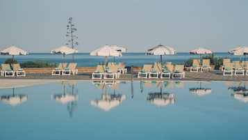 Seasonal outdoor pool, pool umbrellas, sun loungers